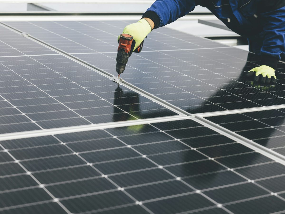 Solar technician working on a panel installation